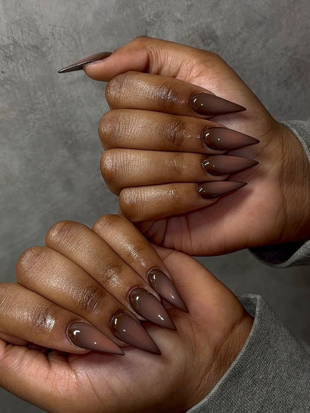 Matte taupe stiletto nails on dark skin, grey brown matte stilettos on deep skin