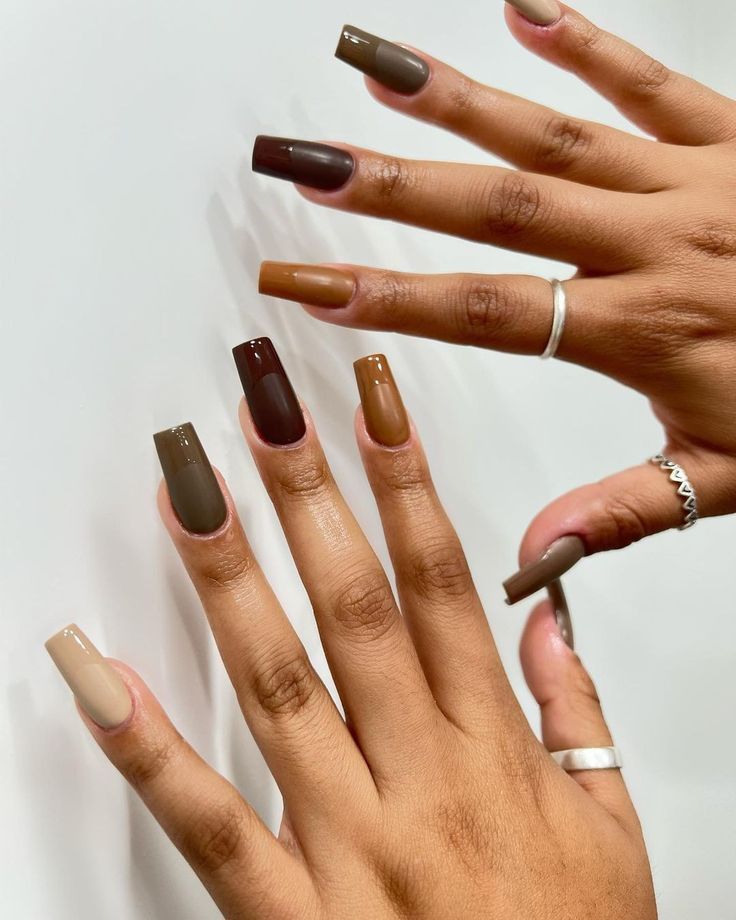 Mixed coffee browns on two hands, every shade from espresso to latte in one set