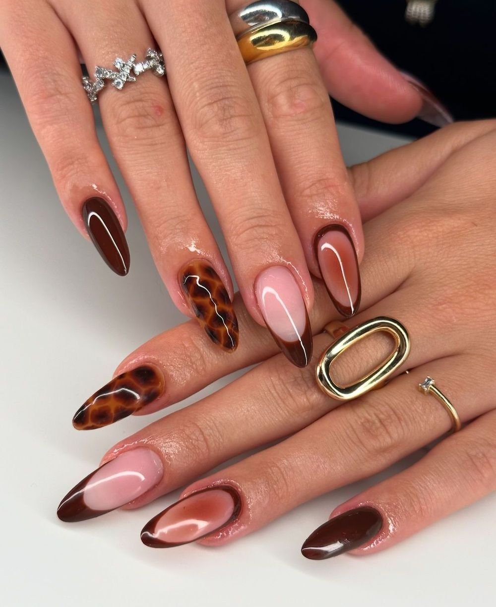 Tortoiseshell French tips with pink almond nails and statement rings, mixed fall set