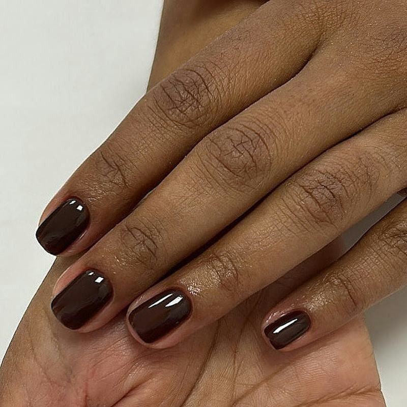 Espresso brown short square nails on brown skin, glossy dark brown gel at a natural short length