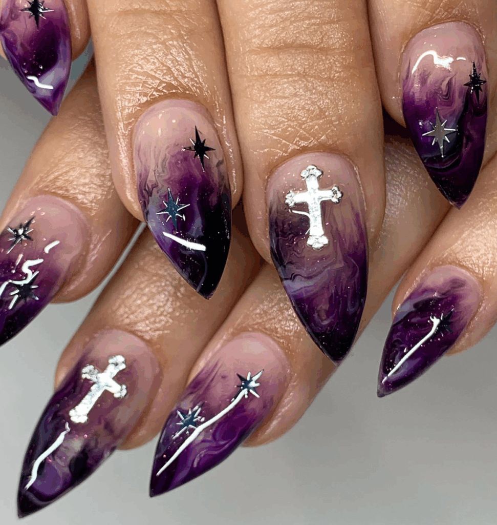 Deep purple marble almond nails on dark skin with silver chrome crosses and star accents
