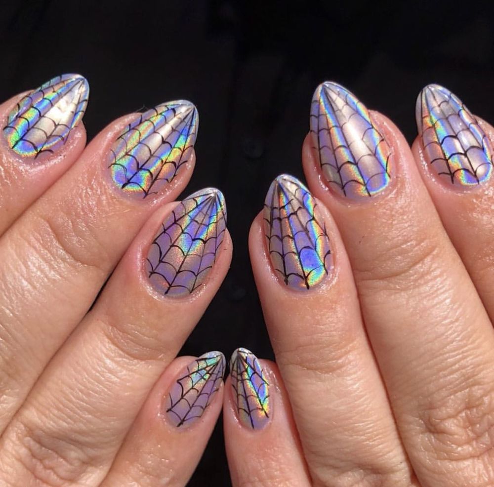 Iridescent holographic almond nails with rainbow spiderweb art on both hands
