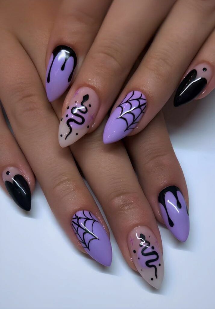 Lavender and lilac almond nails with black snake, spiderweb and drip art