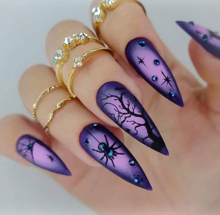 Purple ombre stiletto nails with a black haunted tree, spider and starry night art