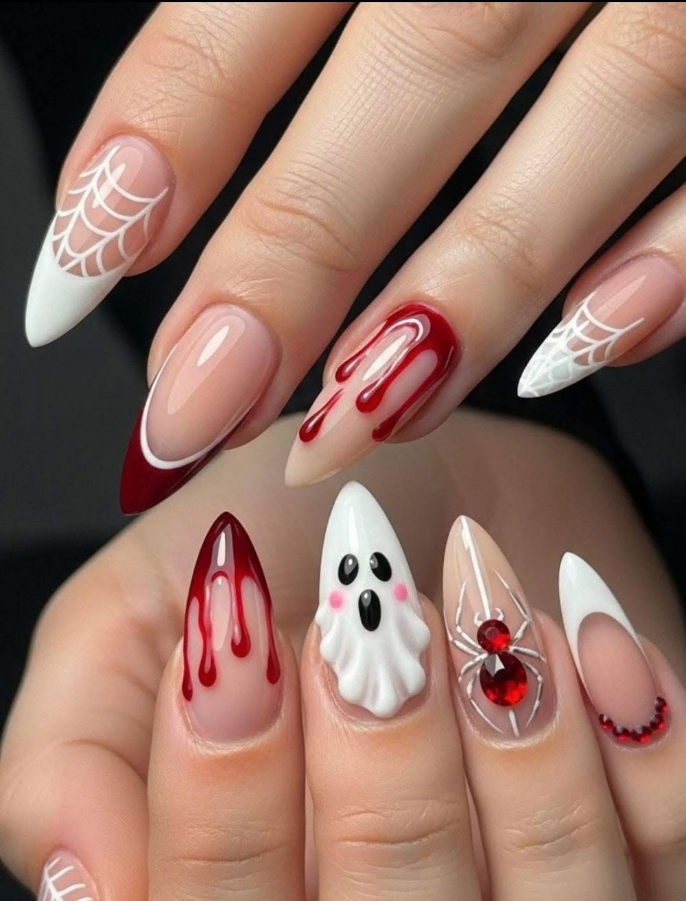 White and nude almond nails with red blood drip, a ghost accent and white web French art