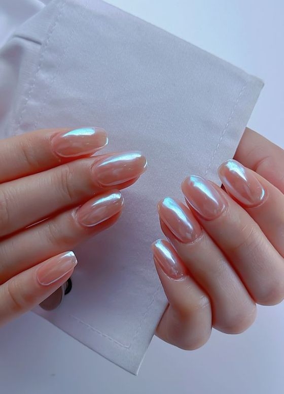 Blue iridescent jelly chrome almond nails, sheer blue with a rainbow sheen