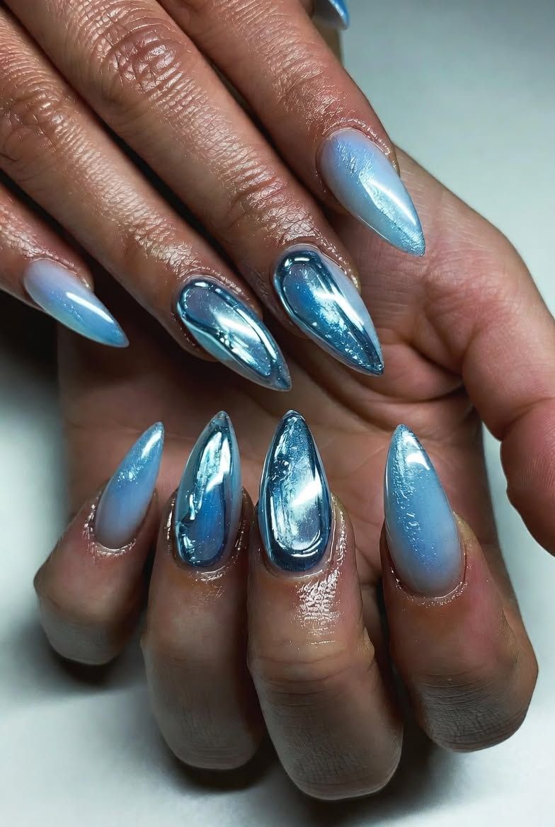Blue metallic jelly chrome stiletto nails on dark skin, vivid blue chrome stilettos
