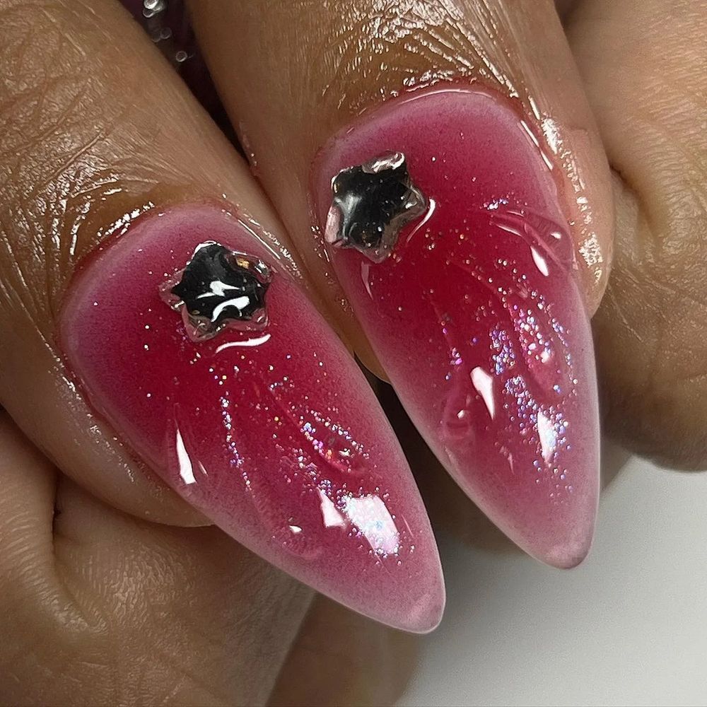 Magenta jelly chrome stiletto nails with star charms, vivid pink chrome with silver stars