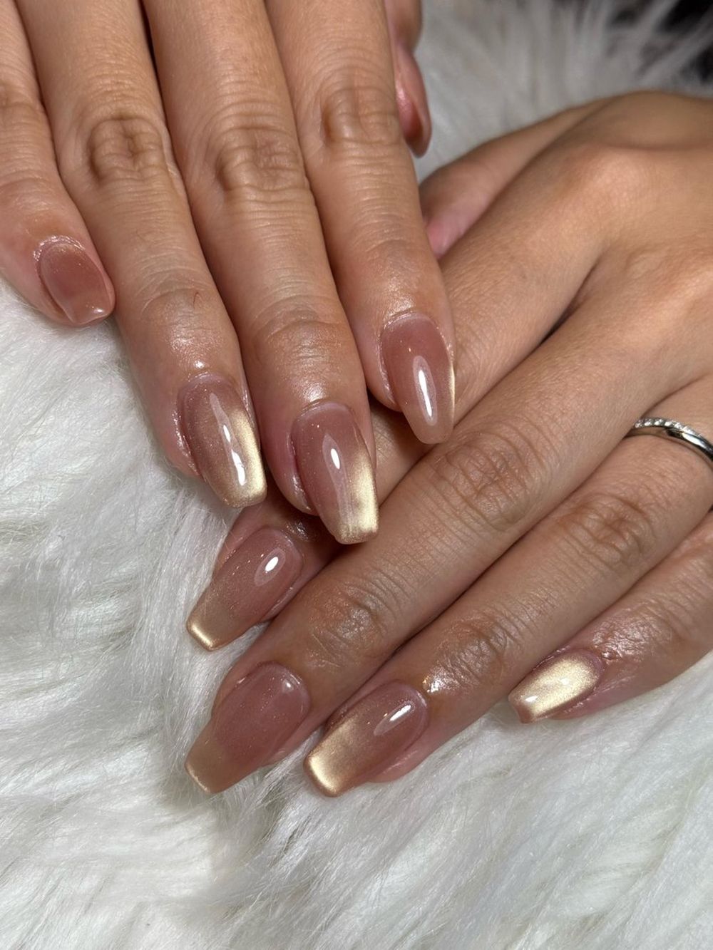 Nude jelly nails with gold chrome French tips, bare jelly base with gold tips