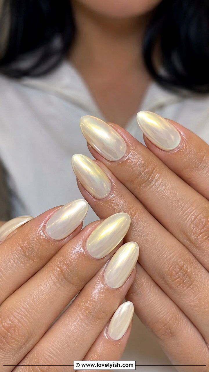 Golden vanilla chrome almond nails, warm vanilla white metallic set