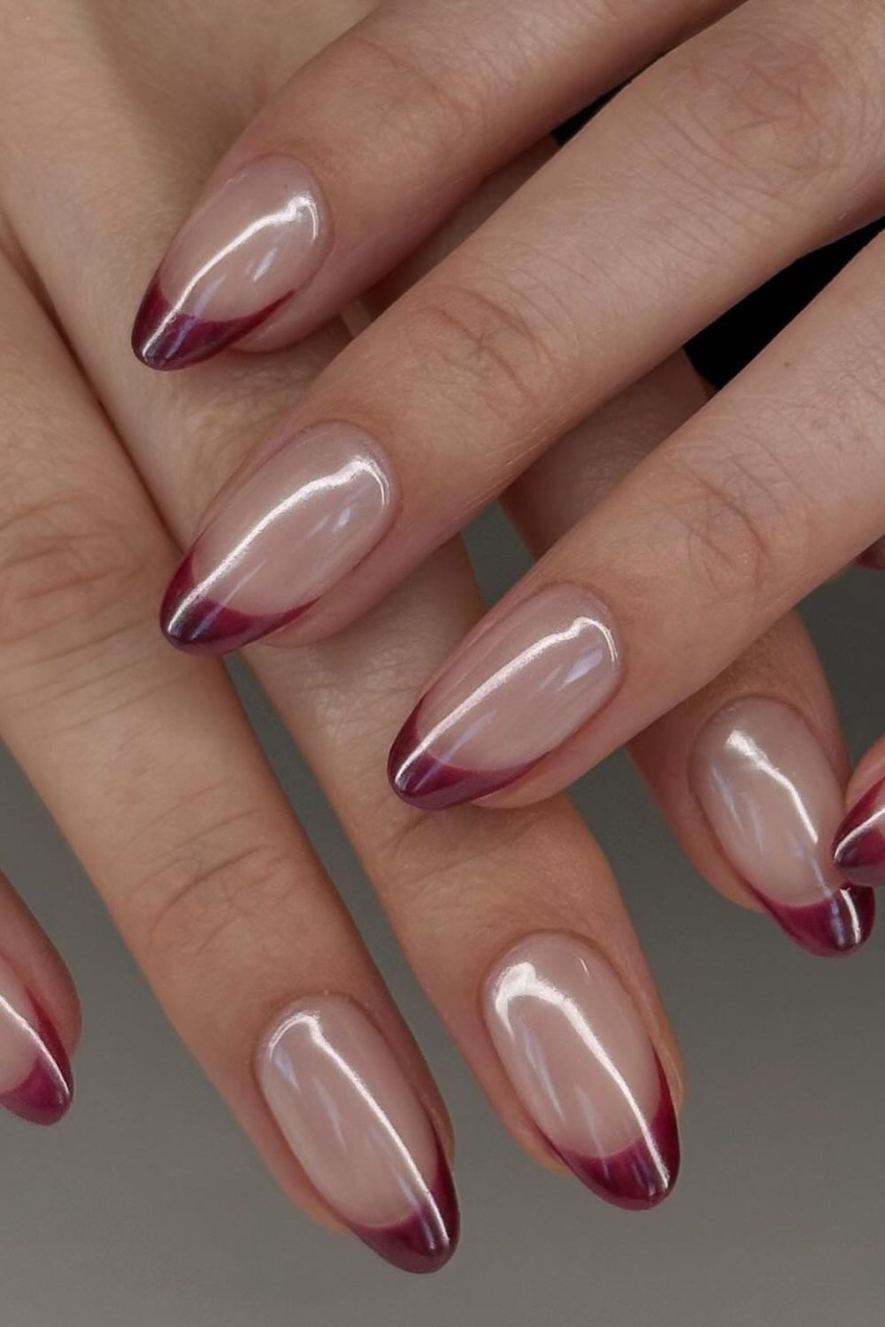 Burgundy ombre French almond nails, wine tips fading into the base