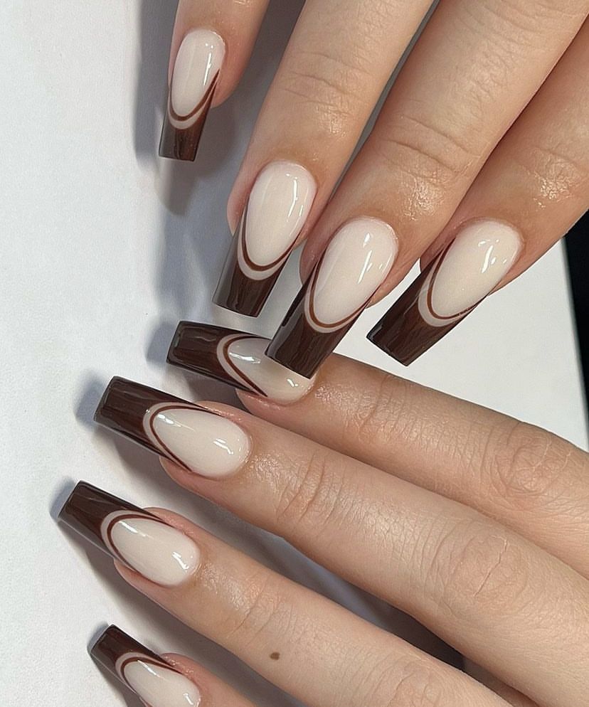 Chocolate French long square nails with a white outline on brown skin, deep brown tips traced in white