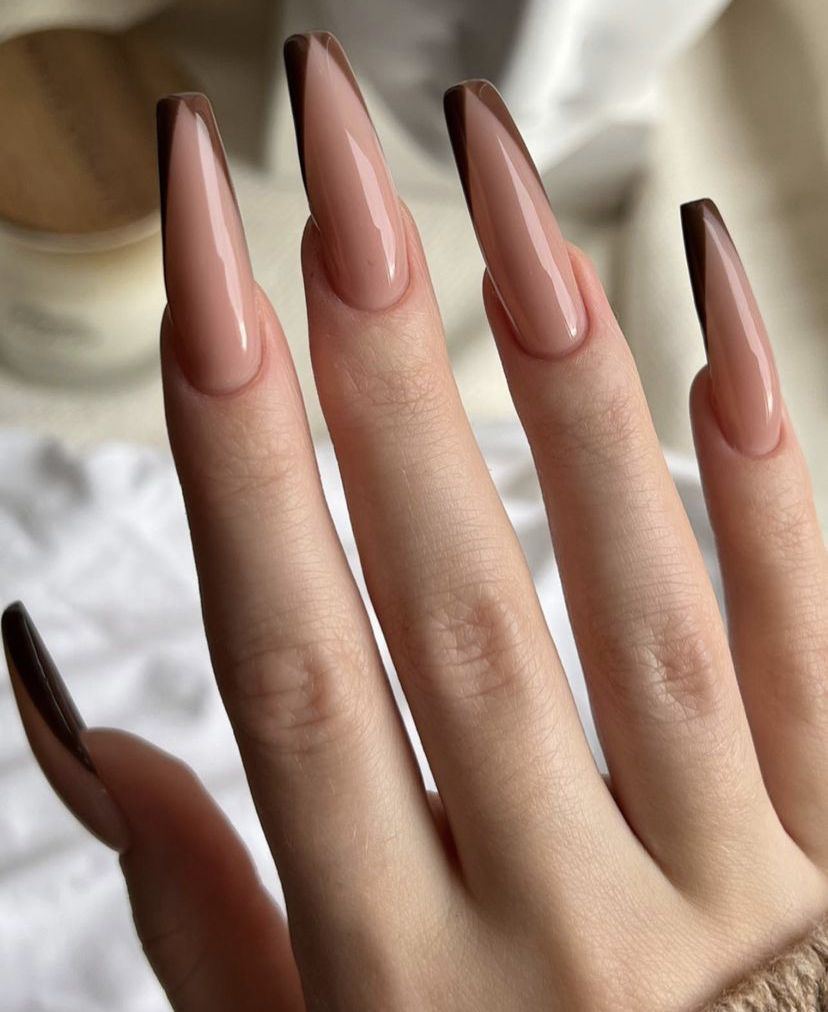 Nude ombre French stiletto nails, tips fading from nude to soft white