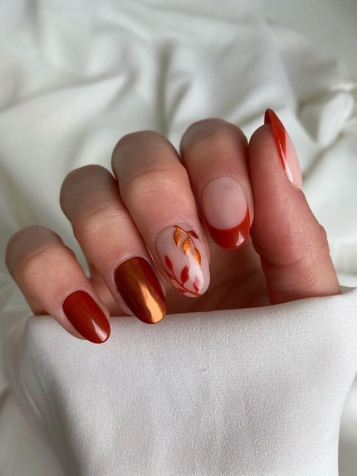 Rust French almond nails with leaf art accents, burnt orange tips with painted leaves