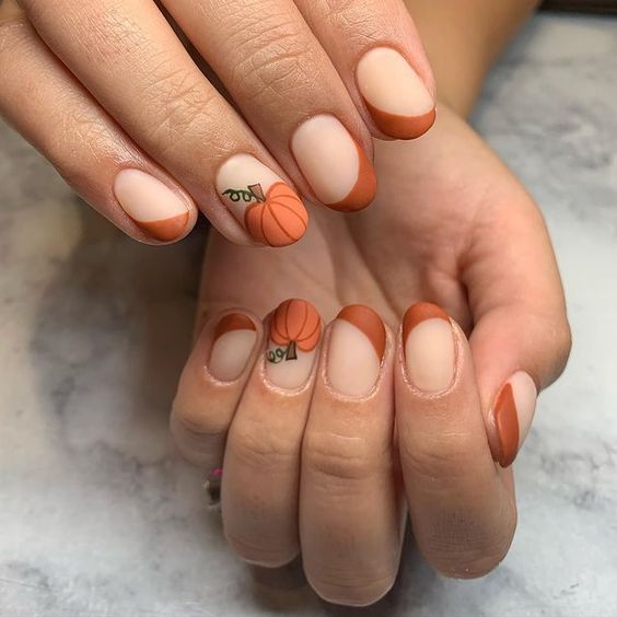 Rust French short nails with pumpkin art, rust tips with a tiny pumpkin accent