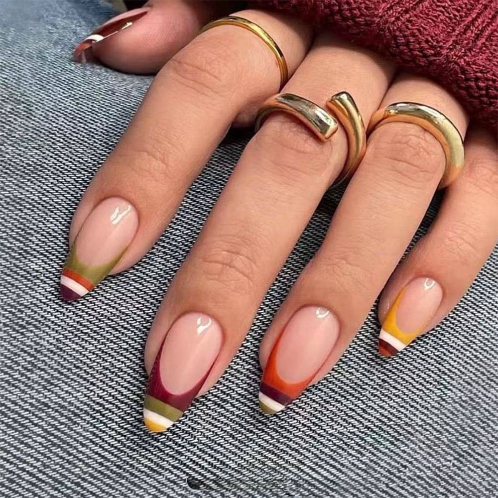 Striped multicolor French short nails on denim, short tips with striped color bands