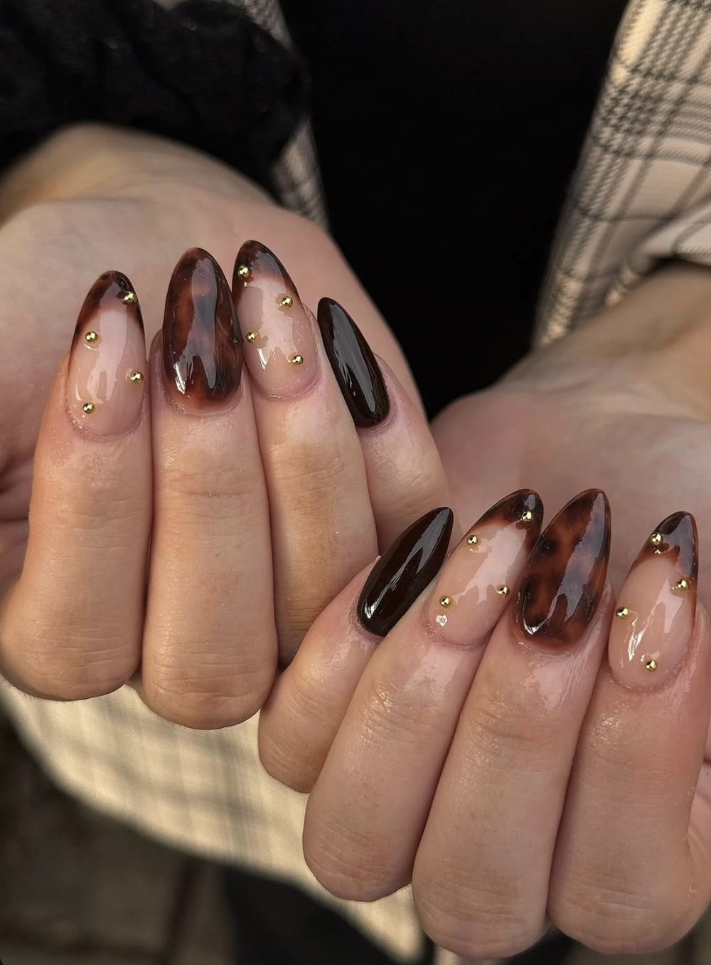 Tortoiseshell French almond nails with gold dots, tortoise tips with tiny gold studs
