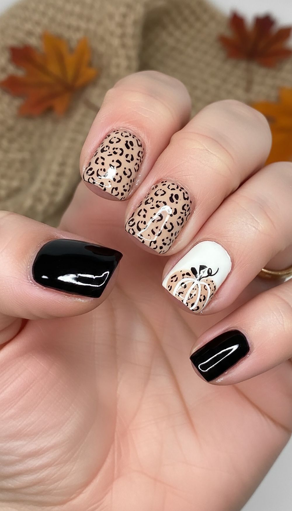 Black and leopard art short nails, black gloss with leopard print and white accent nails