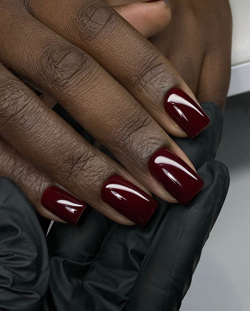 Oxblood short square nails on dark skin, deep glossy wine red short set