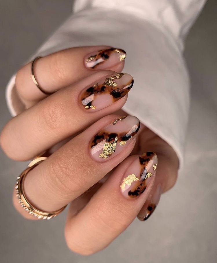 Nude tortoiseshell nails with gold foil, soft amber marble with gold flakes