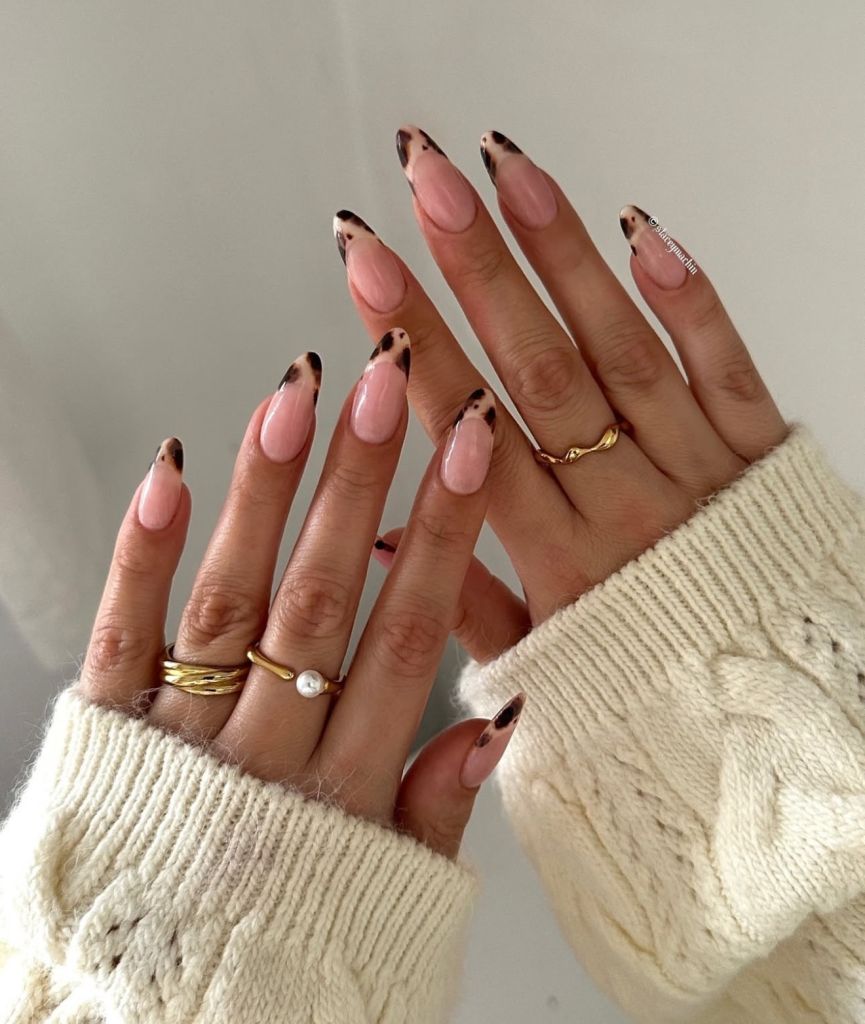 Pink nude nails with tortoiseshell French in a knit, soft pink base with tortoise tips