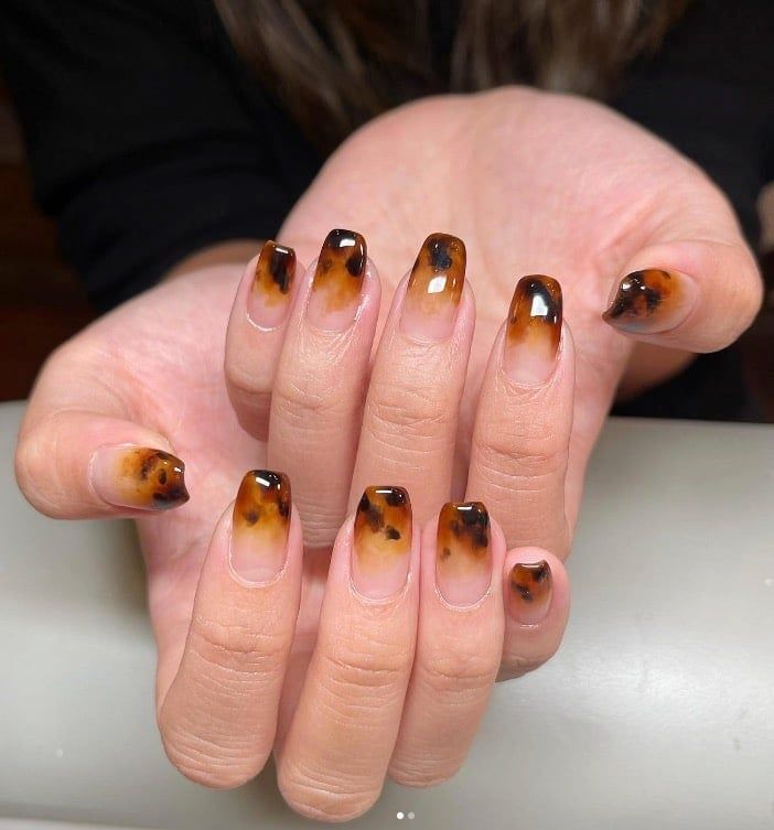 Tortoiseshell fade French short nails, tortoise tips fading into a nude base